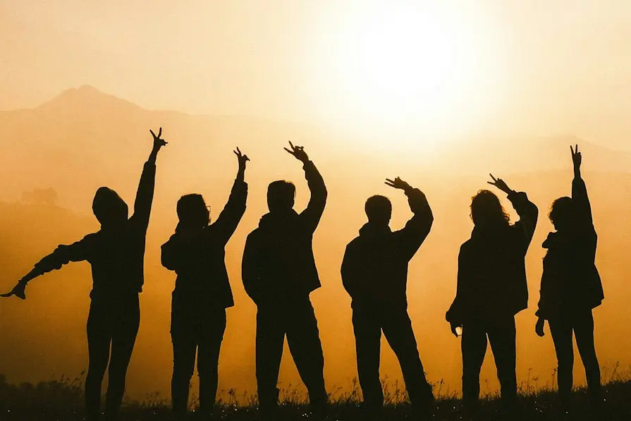 silhouette photo of six persons on top of mountain